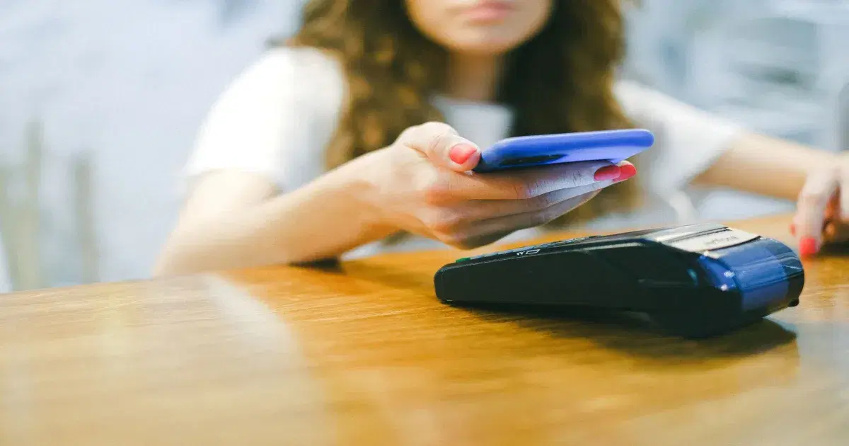 A user paying with her smartphone: bill payment built into an app